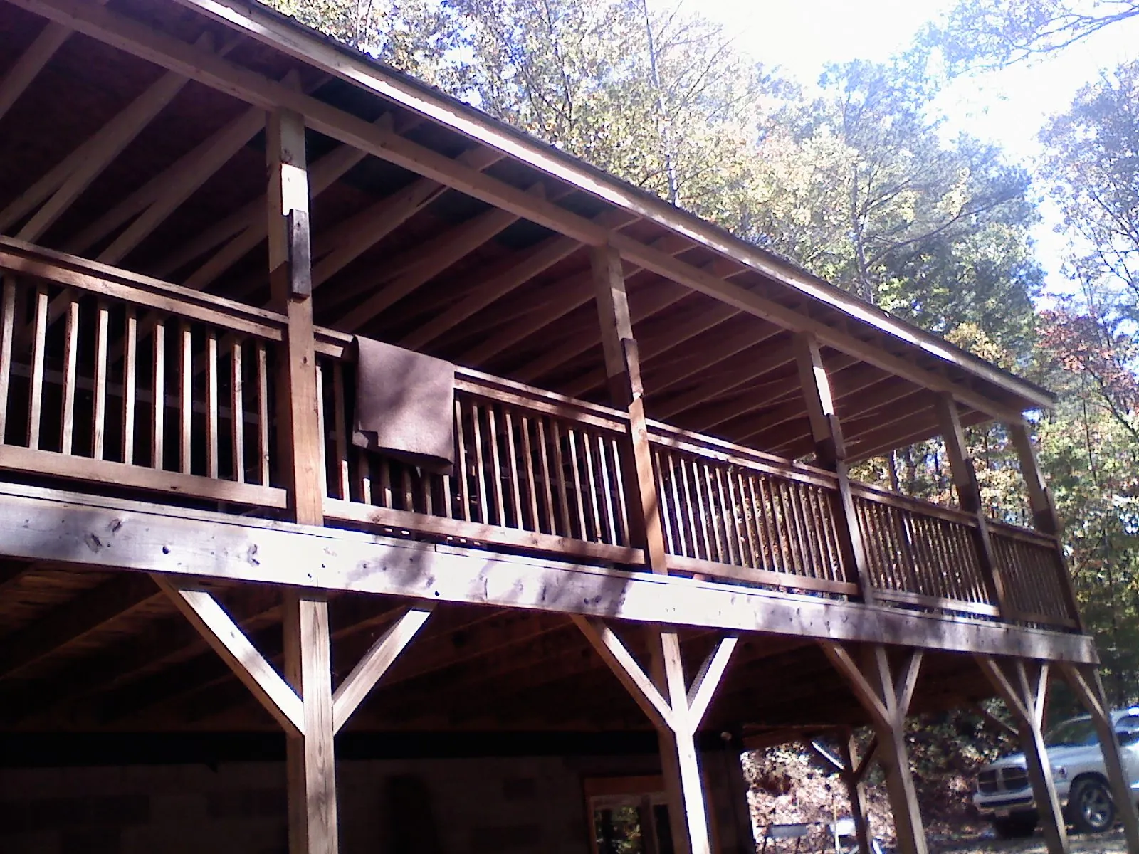 Timber framing under a new elevated porch and deck — Roof Leak Repair in Canadensis by Roofing Brothers